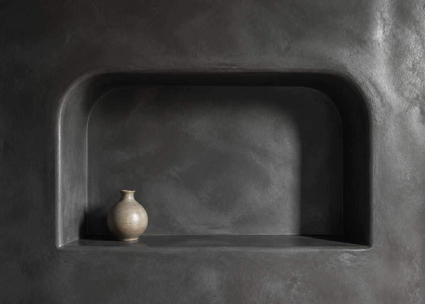 Douchenis in microcement met warme verlichting